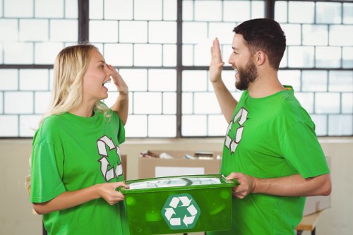 Workers sorting items in a Shoreditch flat for rubbish removal